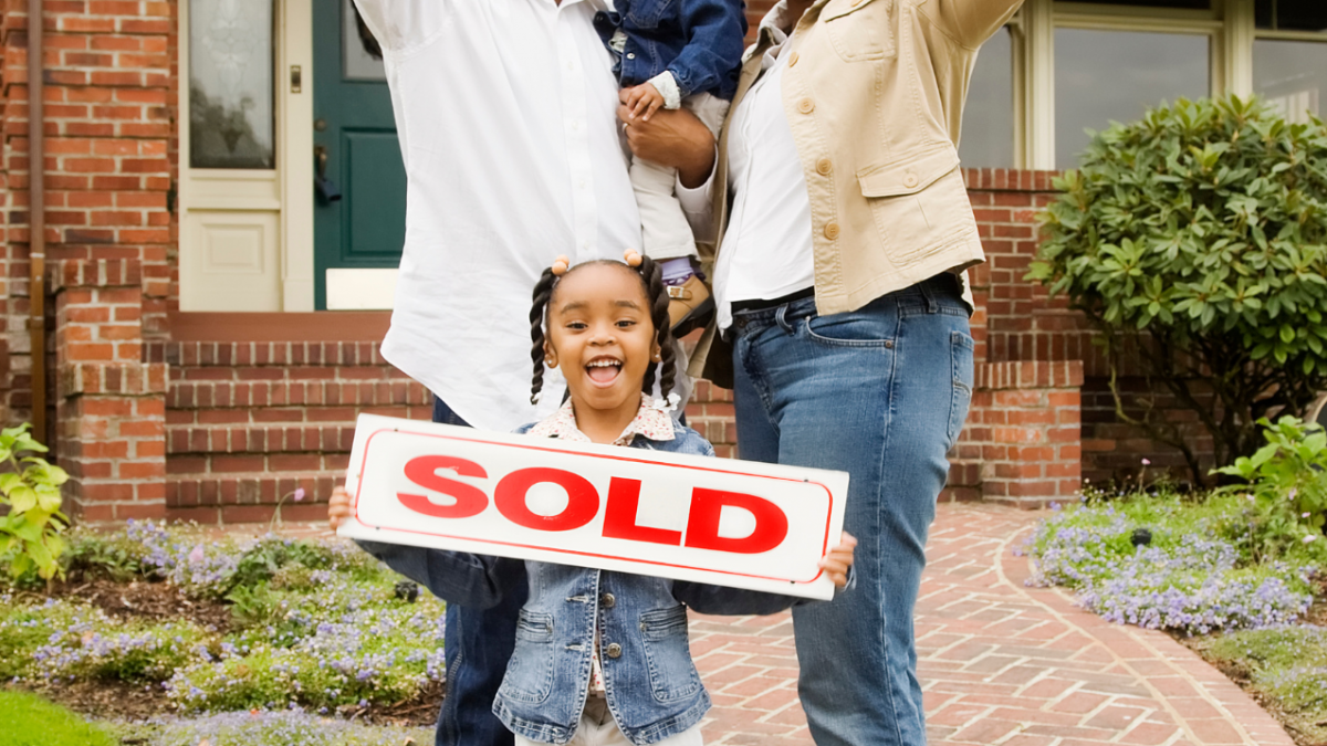 Black Family with Sold Sign