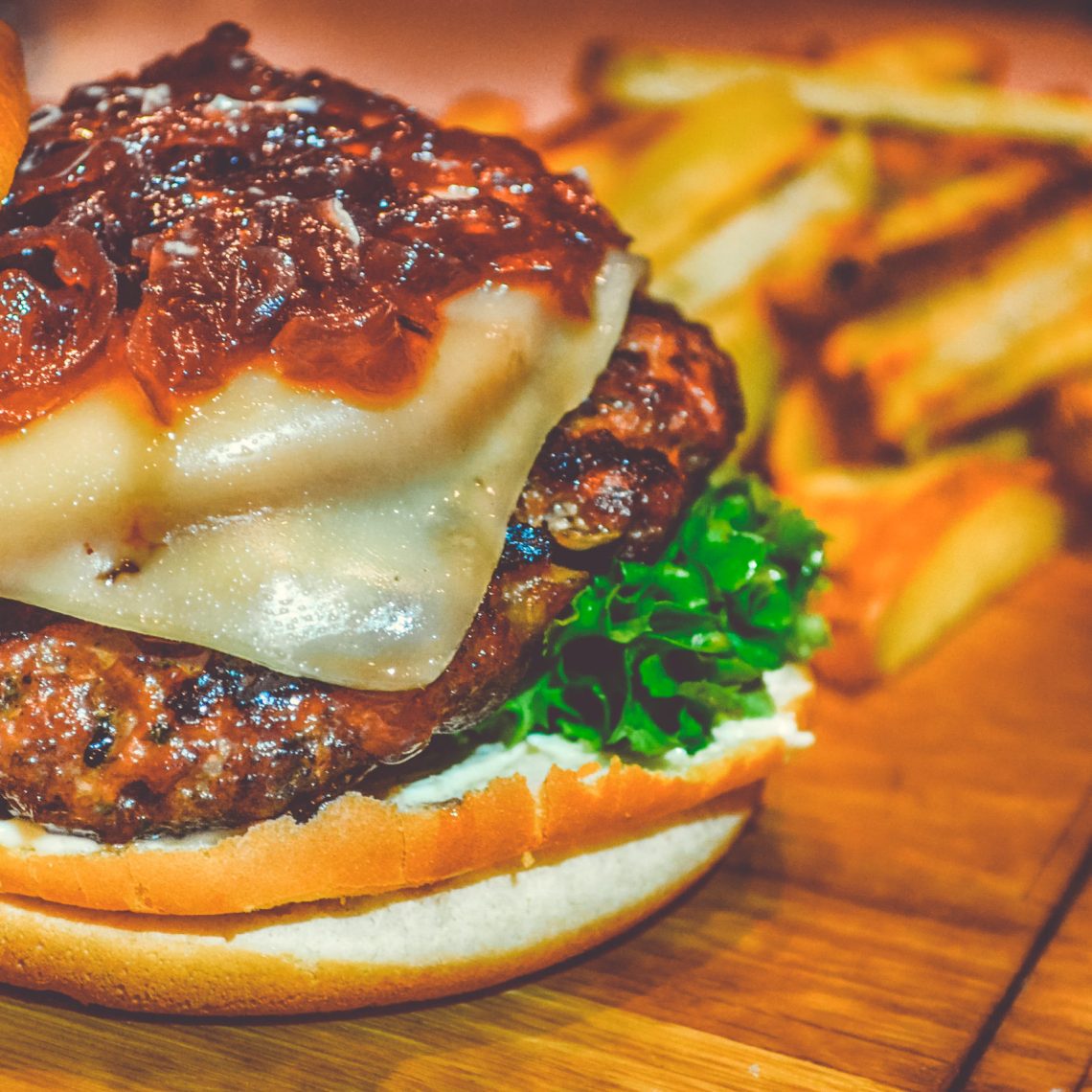 Canva - Selective Focus of Ham Burger on Wooden Surface Photo