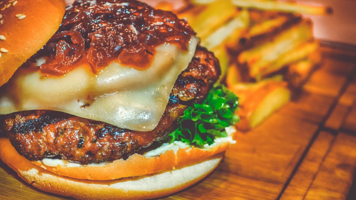 Canva - Selective Focus of Ham Burger on Wooden Surface Photo